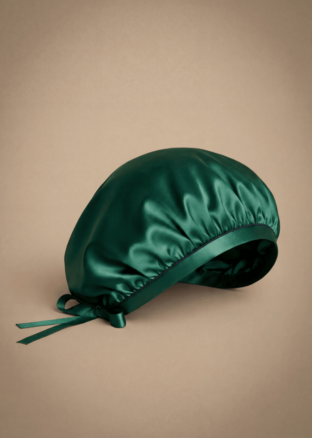 Emerald green silk hair bonnet with midnight blue trim by Miaveriana