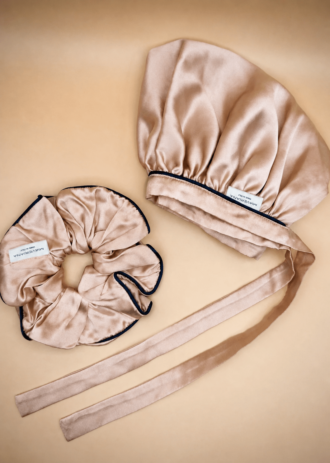 Rose gold silk hair bonnet and scrunchie with midnight blue trim by Miaveriana